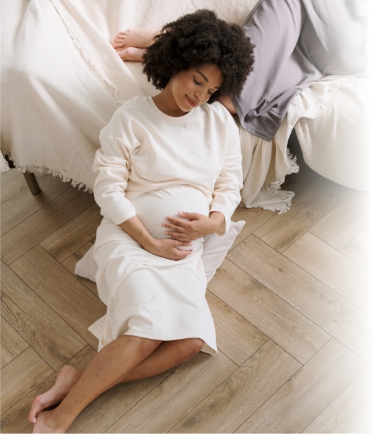 Surrogate mother holding her belly